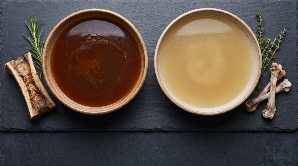 Two bowls of bone broth compared overhead, dark rich beef broth beside pale golden chicken broth