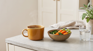 Bone broth cleanse reset shown with mug of broth beside a bowl of gentle whole foods