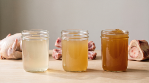 Three glass jars comparing thin broth, medium stock, and rich gelled bone broth side by side